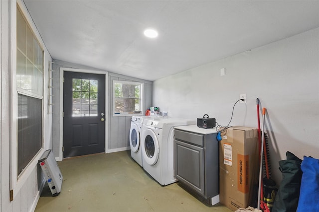 washroom featuring cabinet space and independent washer and dryer