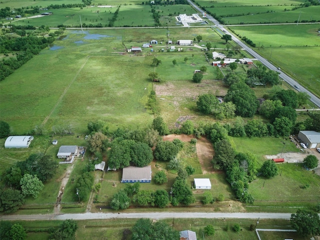 birds eye view of property with a rural view