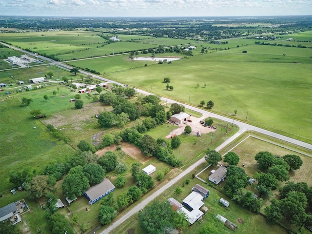 birds eye view of property with a rural view