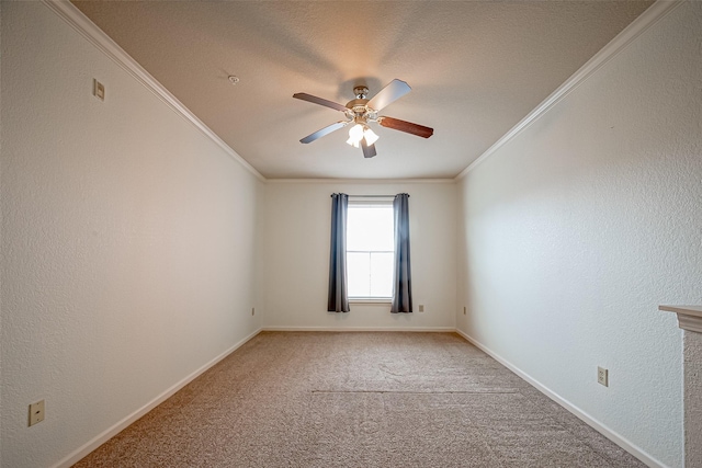 unfurnished room with crown molding, ceiling fan, carpet flooring, and baseboards