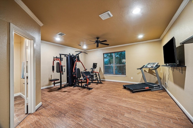 36927 Anglers Way, Pinehurst, TX 77362 - workout room with ornamental molding, wood finished floors, recessed lighting, ceiling fan, and a textured wall