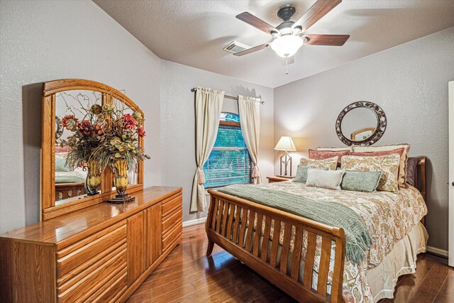 36927 Anglers Way, Pinehurst, TX 77362 - bedroom with hardwood / wood-style floors, baseboards, a textured wall, and ceiling fan