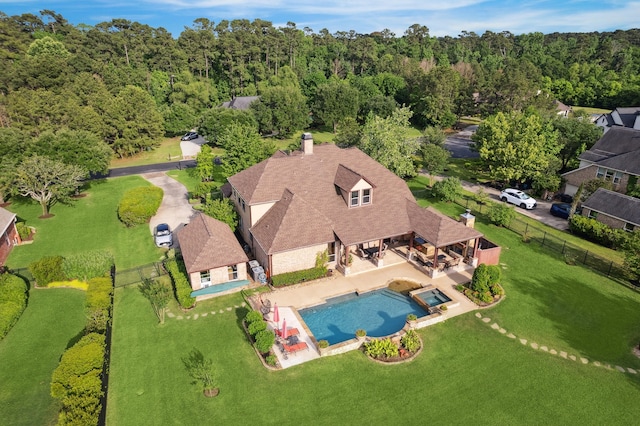 36927 Anglers Way, Pinehurst, TX 77362 - view from above of property featuring a pool and a forest