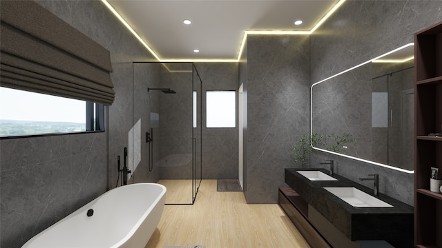 7125 England St, Houston, TX 77021 - full bath with a sink, a shower with shower door, a soaking tub, and tile walls