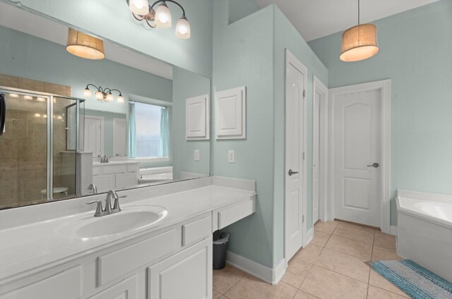 full bath with tile patterned flooring, vanity, baseboards, a shower stall, and a bath