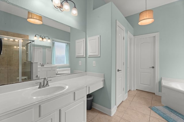 1619 Julia Park Dr, Spring, TX 77386 - full bath with tile patterned floors, a shower stall, a garden tub, vanity, and baseboards