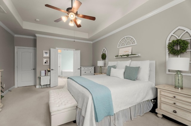 1619 Julia Park Dr, Spring, TX 77386 - bedroom with a tray ceiling, light carpet, ensuite bath, a ceiling fan, and crown molding