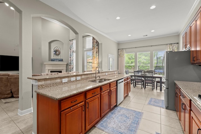 1619 Julia Park Dr, Spring, TX 77386 - kitchen with a sink, stainless steel appliances, light tile patterned floors, open floor plan, and crown molding