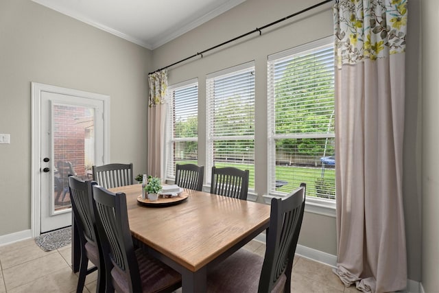 1619 Julia Park Dr, Spring, TX 77386 - dining area featuring light tile patterned floors, crown molding, healthy amount of natural light, and baseboards