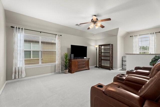 living area with baseboards, carpet flooring, ceiling fan, and visible vents