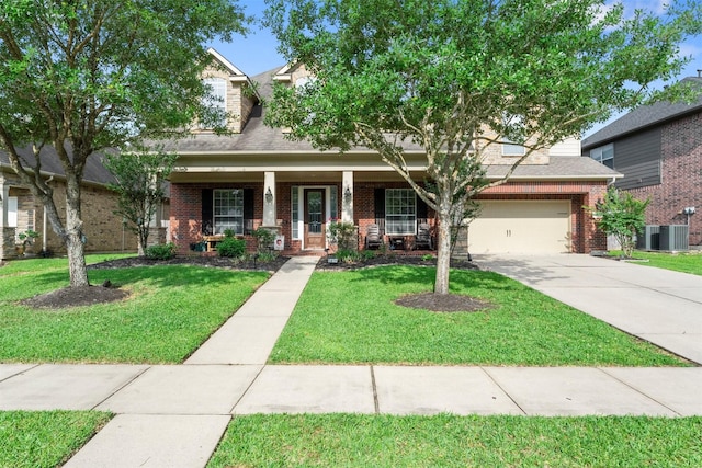 view of front of property with covered porch, brick siding, driveway, and a front lawn