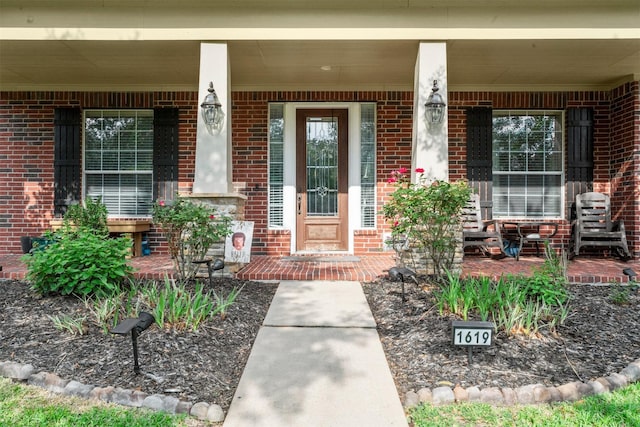 1619 Julia Park Dr, Spring, TX 77386 - doorway to property featuring a porch and brick siding
