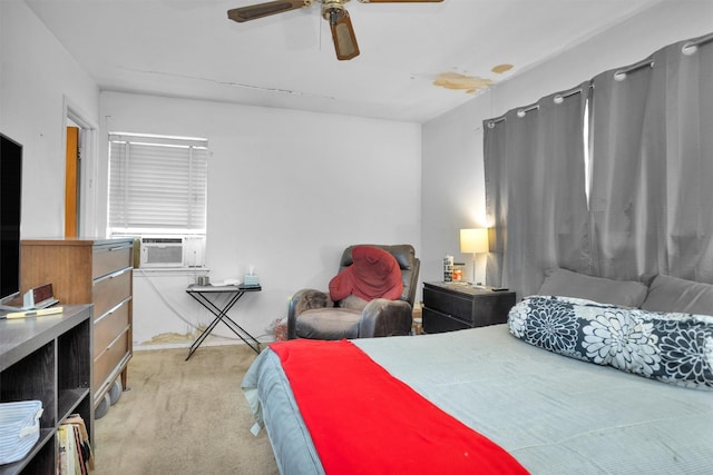 bedroom with cooling unit, light carpet, and ceiling fan