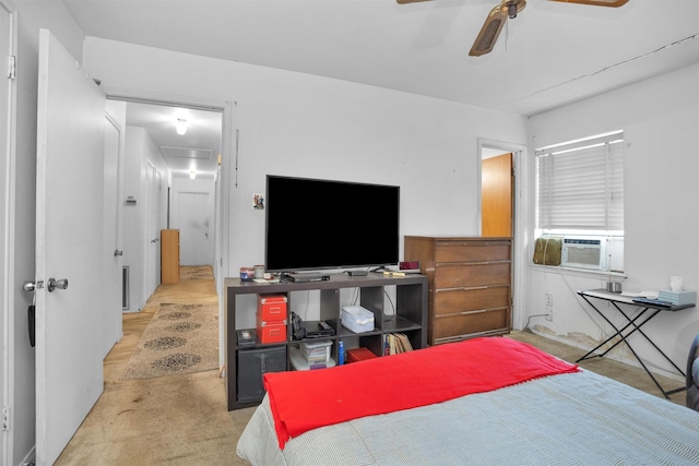 carpeted bedroom featuring cooling unit and a ceiling fan