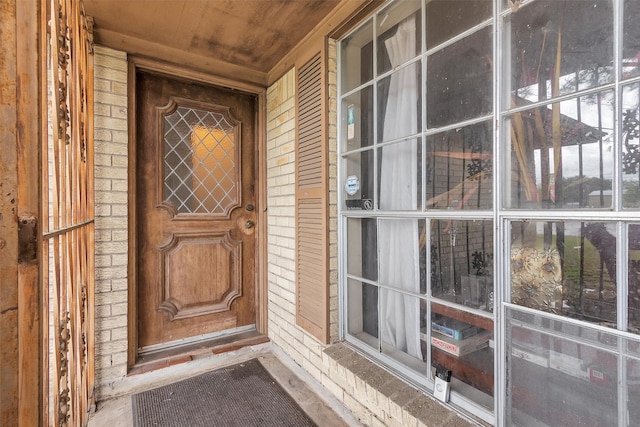 view of exterior entry featuring a porch