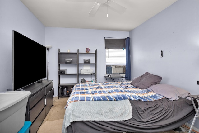 bedroom featuring ceiling fan, cooling unit, and light carpet
