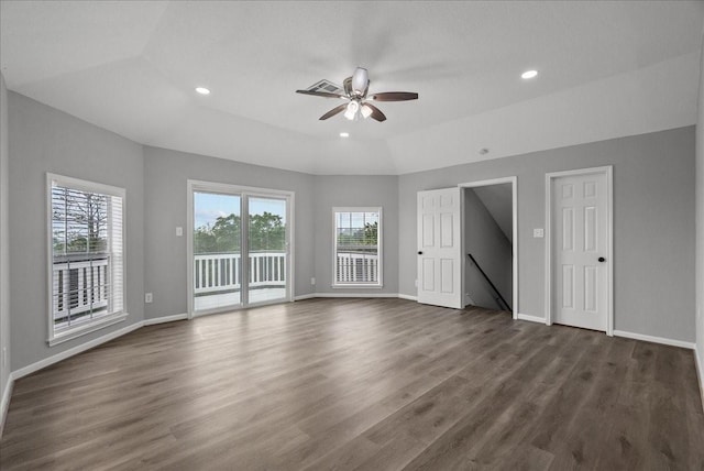 interior space featuring baseboards, a wealth of natural light, dark wood-style flooring, and ceiling fan