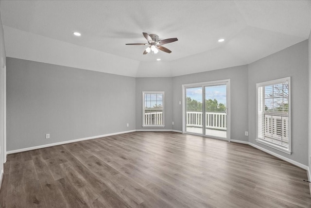 spare room with baseboards, recessed lighting, wood finished floors, and a ceiling fan