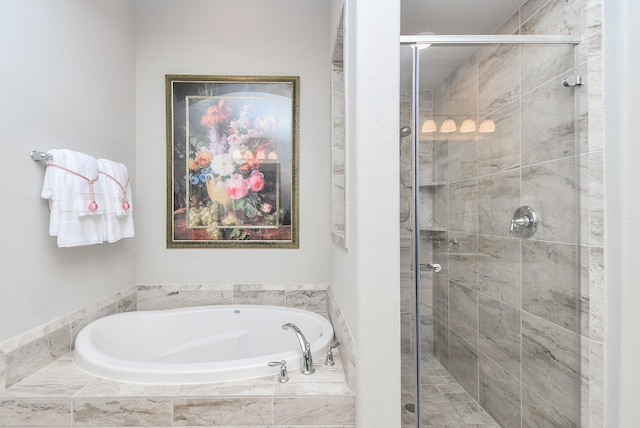 bathroom with a shower stall and a bath