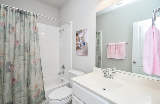 full bath with vanity, toilet, visible vents, and shower / bath combo with shower curtain