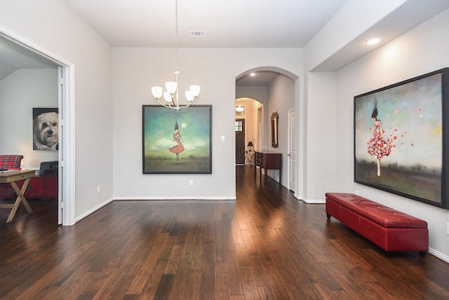 dining area featuring visible vents, arched walkways, wood finished floors, a chandelier, and recessed lighting