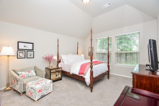 carpeted bedroom with baseboards, vaulted ceiling, and visible vents