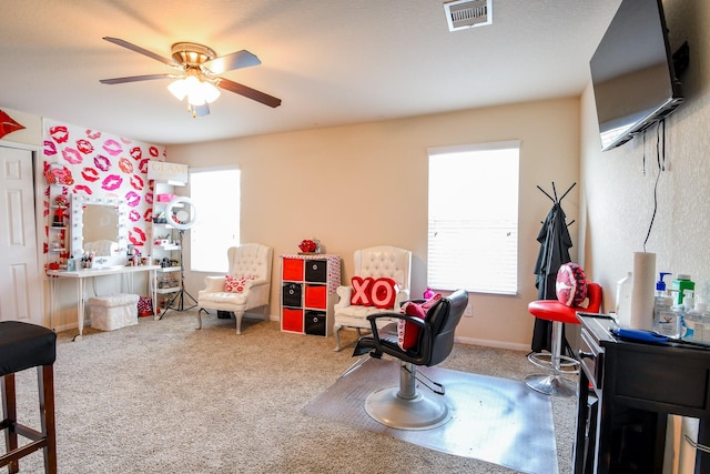 rec room with visible vents, ceiling fan, and carpet floors