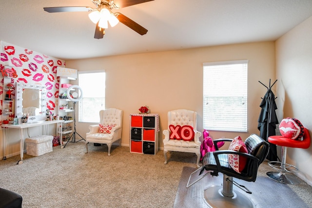 rec room with carpet flooring and ceiling fan