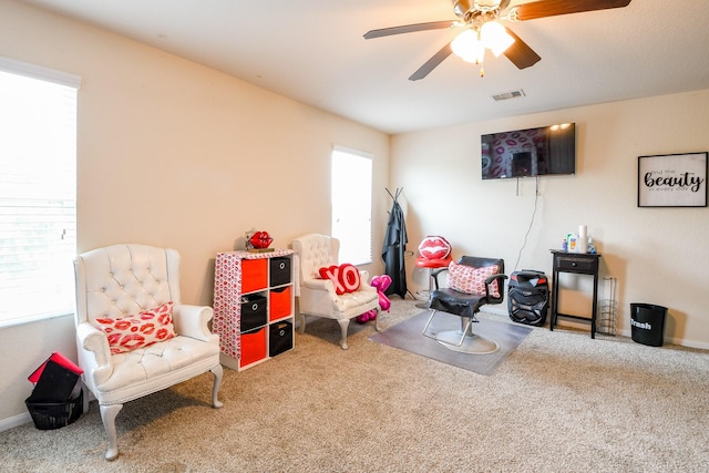 playroom featuring baseboards, visible vents, a ceiling fan, and carpet