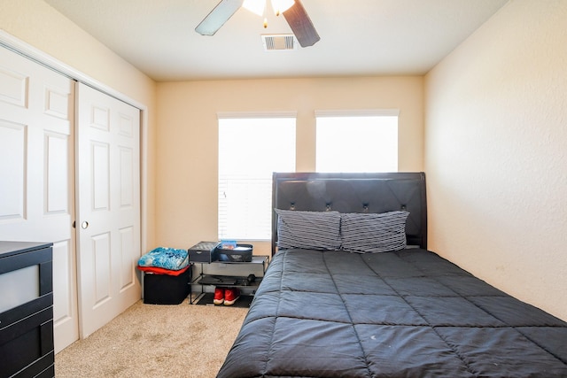 bedroom featuring visible vents, a ceiling fan, and carpet floors