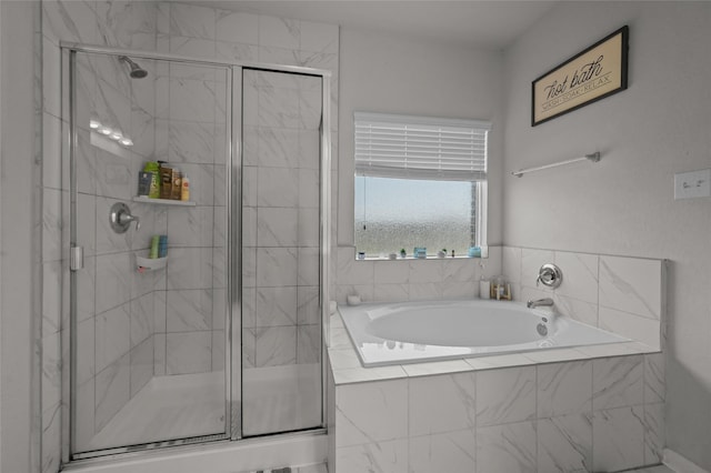 full bath with a garden tub and a shower stall