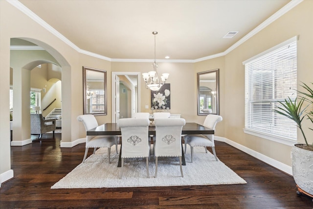 dining room with baseboards, a chandelier, ornamental molding, and dark wood-type flooring