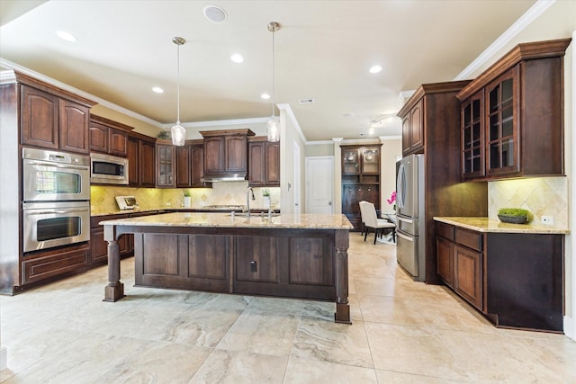 kitchen featuring under cabinet range hood, stainless steel appliances, ornamental molding, and tasteful backsplash