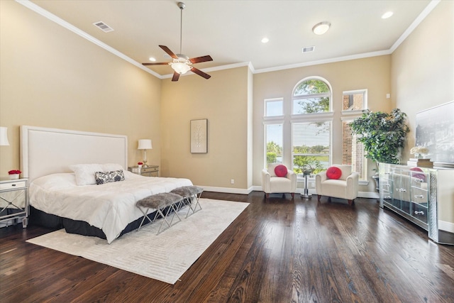 bedroom with visible vents, ornamental molding, and wood finished floors