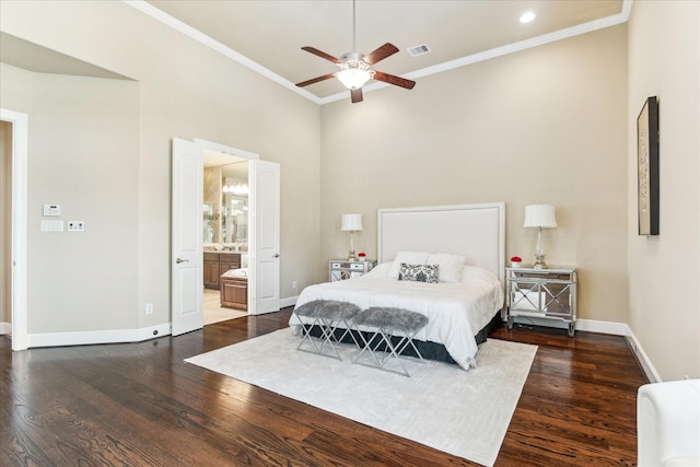 bedroom with baseboards, ornamental molding, wood finished floors, and visible vents