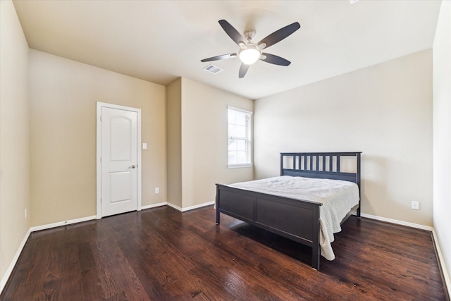 bedroom with ceiling fan, baseboards, visible vents, and wood finished floors