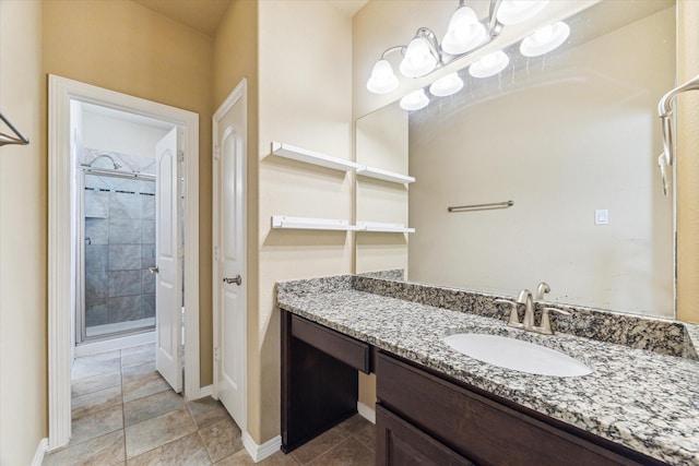 full bathroom with baseboards, a shower stall, tile patterned floors, and vanity