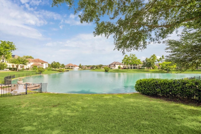 water view featuring fence and a residential view