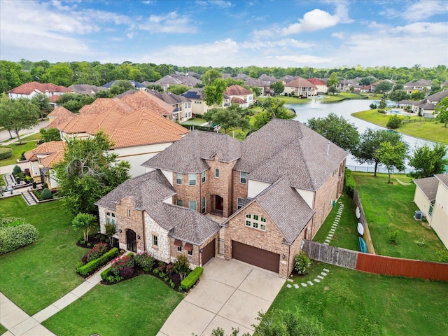 aerial view featuring a water view and a residential view