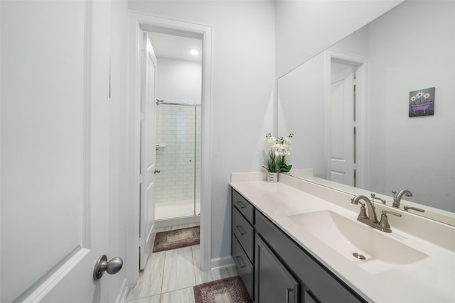 bathroom featuring vanity and a stall shower