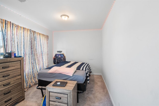 bedroom featuring baseboards and carpet floors
