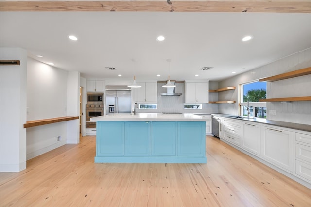 kitchen with built in appliances, open shelves, visible vents, light wood-style flooring, and white cabinets