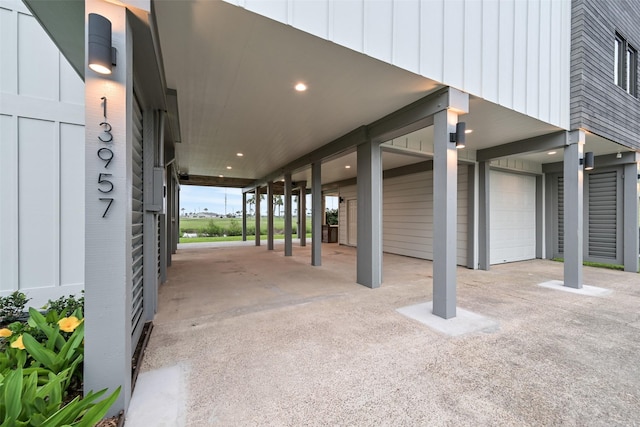 view of patio featuring a garage and a carport