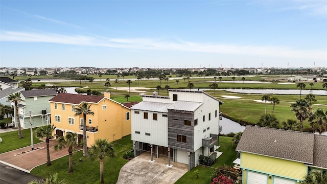 bird's eye view with a residential view, a water view, and view of golf course