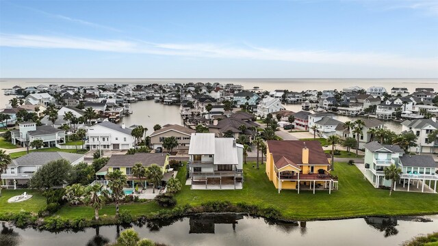 birds eye view of property with a residential view and a water view