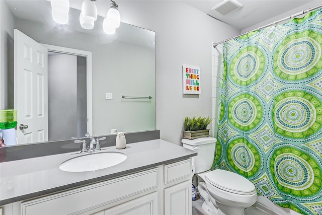 bathroom featuring visible vents, toilet, curtained shower, and vanity