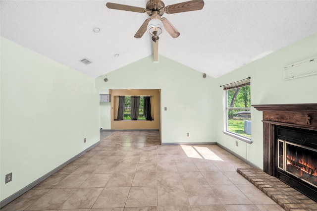 20983 Westgrove Ln, Porter, TX 77365 - unfurnished living room featuring lofted ceiling with beams, visible vents, ceiling fan, light tile patterned floors, and a glass covered fireplace