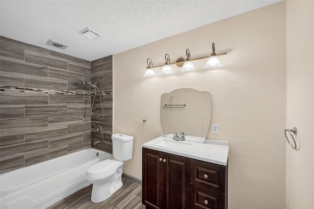 20983 Westgrove Ln, Porter, TX 77365 - bathroom with toilet, wood finished floors, vanity, a textured ceiling, and bathing tub / shower combination