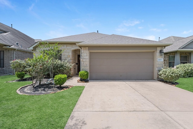 ranch-style home with a front yard, concrete driveway, stone siding, and a garage