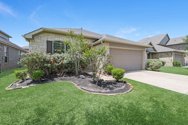 view of front facade with a front yard, concrete driveway, stone siding, and a garage